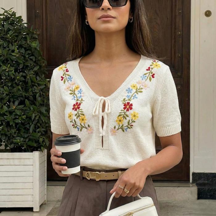 Embroidered Knit Top with Floral Detailing Tie Front V Neckline Soft Lightweight Feel Short Sleeves and Feminine Relaxed Silhouette Perfect for Casual Outings Brunch and Effortless Everyday Style