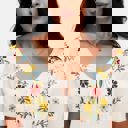 Large Embroidered Knit Top with Floral Detailing Tie Front V Neckline Soft Lightweight Feel Short Sleeves and Feminine Relaxed Silhouette Perfect for Casual Outings Brunch and Effortless Everyday Style