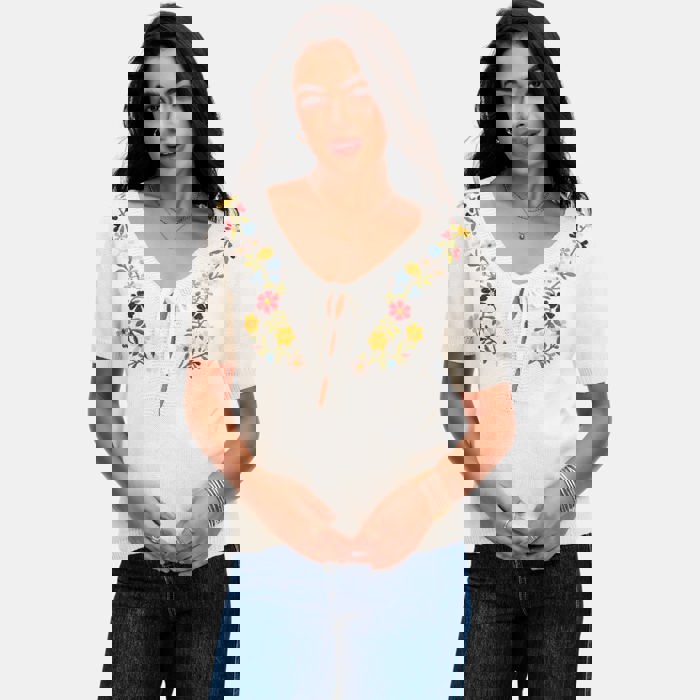 Embroidered Knit Top with Floral Detailing Tie Front V Neckline Soft Lightweight Feel Short Sleeves and Feminine Relaxed Silhouette Perfect for Casual Outings Brunch and Effortless Everyday Style