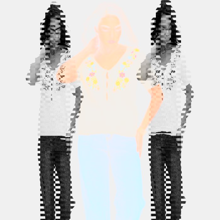 Embroidered Knit Top with Floral Detailing Tie Front V Neckline Soft Lightweight Feel Short Sleeves and Feminine Relaxed Silhouette Perfect for Casual Outings Brunch and Effortless Everyday Style