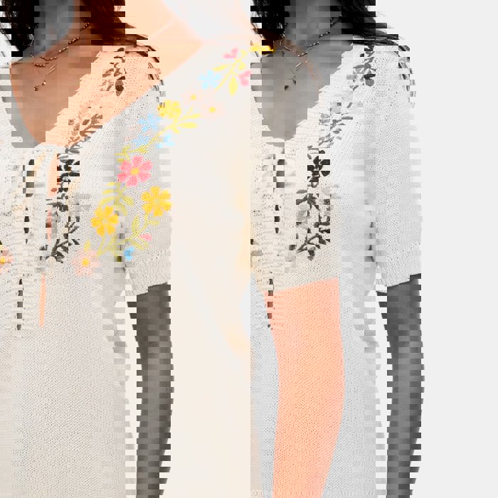 Embroidered Knit Top with Floral Detailing Tie Front V Neckline Soft Lightweight Feel Short Sleeves and Feminine Relaxed Silhouette Perfect for Casual Outings Brunch and Effortless Everyday Style