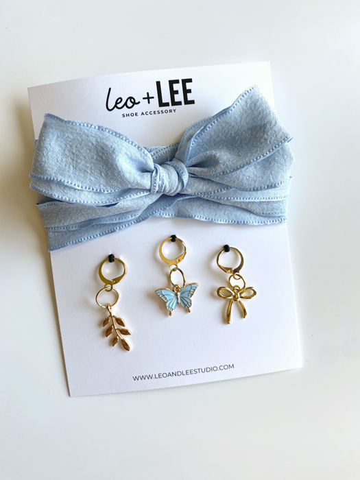 Blue Shoe Laces with Fern, Butterfly & Bow Shoe Charm Set