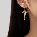  Very Carrot Silver Flowing Elegance Bow Earrings