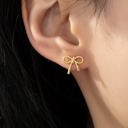  Very Carrot Small textured brass bow stud earrings