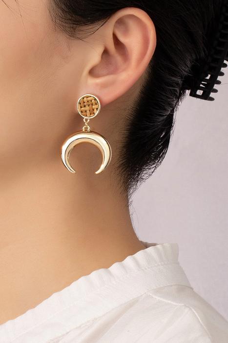 Very Carrot Metal horn drop earrings topped by a woven rattan disk