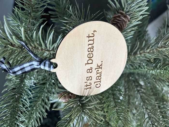It's a beaut, clark. - Engraved Maple Ornament with Buffalo Plaid Ribbon