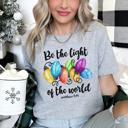  Christmas Bible Verse 'Be The Light' Holiday Bella Canvas Tee