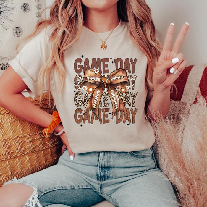 Game Day Football T-Shirt – Brown Bow & Leopard Graphic, Fall Tailgate Tee for Women, Cute Sports Fan Shirt