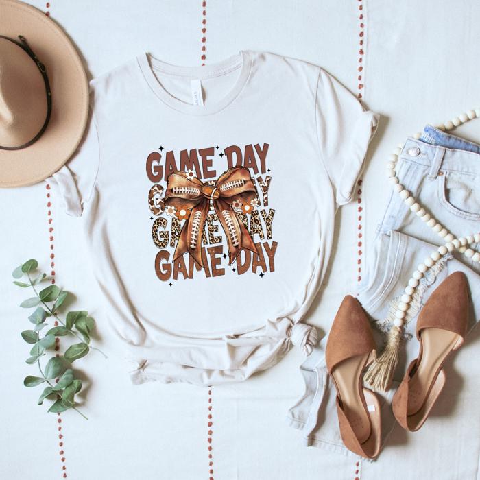 Game Day Football T-Shirt – Brown Bow & Leopard Graphic, Fall Tailgate Tee for Women, Cute Sports Fan Shirt