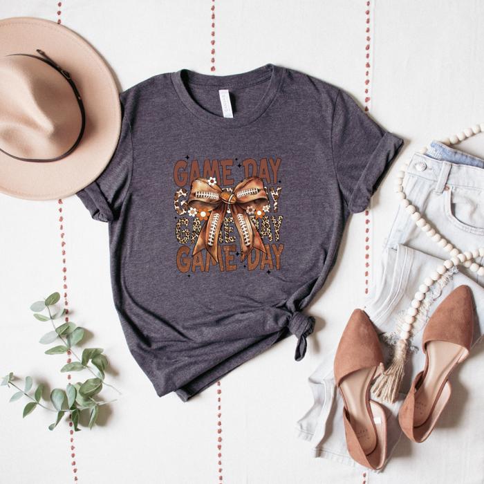 Game Day Football T-Shirt – Brown Bow & Leopard Graphic, Fall Tailgate Tee for Women, Cute Sports Fan Shirt