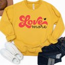  Love More Graphic Sweatshirt