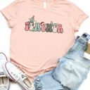 Small Peach Christmas Teacher Graphic Tee