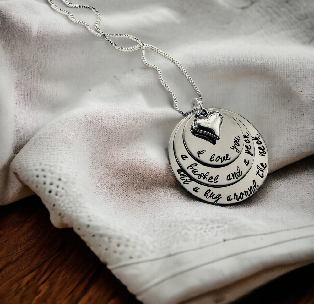 I love you a bushel and a peck and a hug around the neck hand engraved necklace 