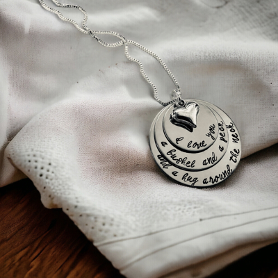 I love you a bushel and a peck and a hug around the neck hand engraved necklace 